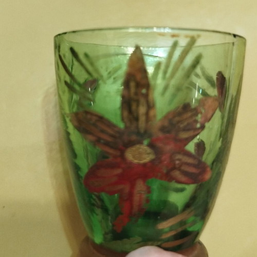 Vintage carafe with used red and green glasses