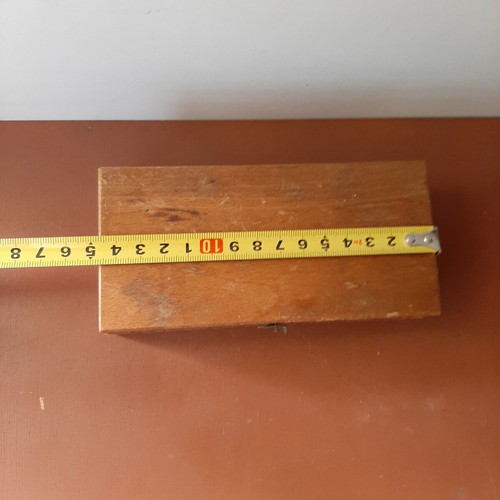 Wooden collectible box with cast iron weights