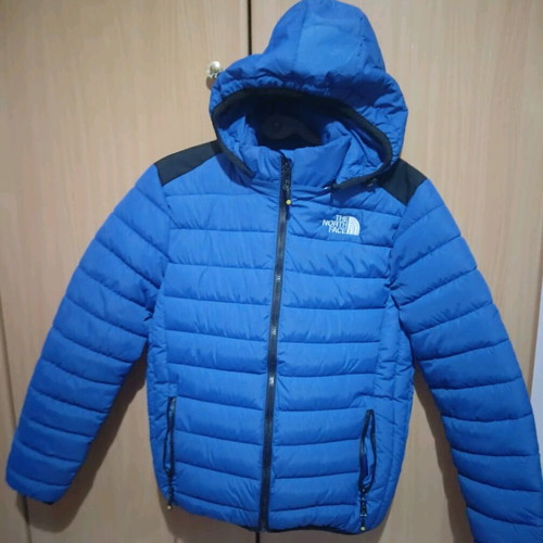 The North Face blue jacket like new, size M unisex