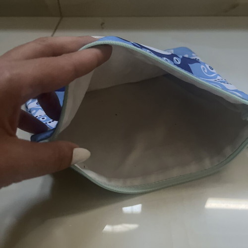 Blue fabric toiletry bag with eye design, 25 x 21 cm