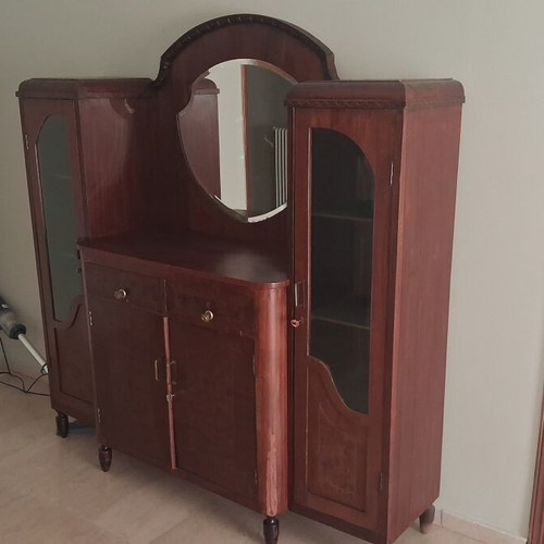 Large wooden antique sideboard with glass cabinets and mirror