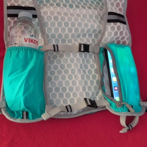 Running vest with adjustable straps and water bladder pocket, one size