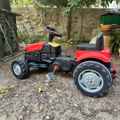 Small red pedal tractor for kids like new