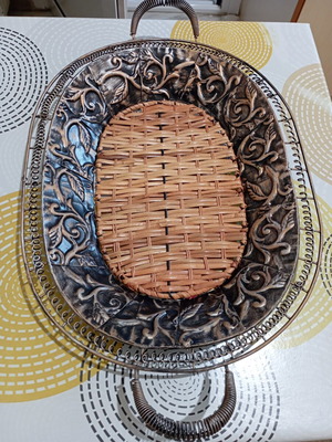 Vintage handmade metal fruit bowl with woven base