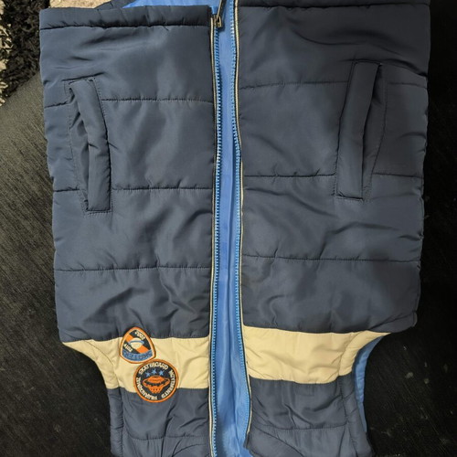 Sleeveless baby vest, blue with beige detail