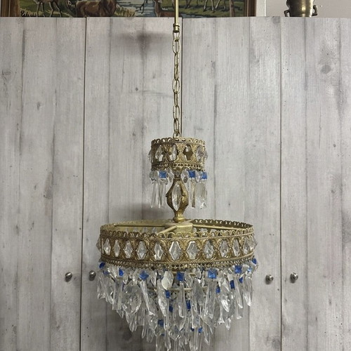 Vintage gold chandelier used with crystals and blue details