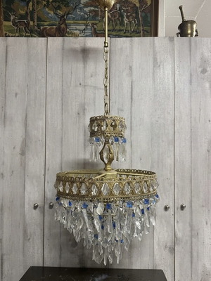 Vintage gold chandelier used with crystals and blue details