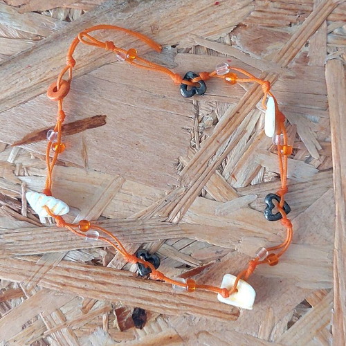 Handmade orange anklet with shells and metal hearts