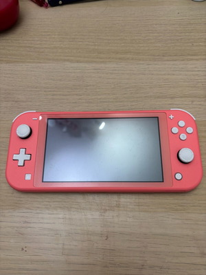 Nintendo Switch Lite like new with 2 games, charger, and 64GB SD card