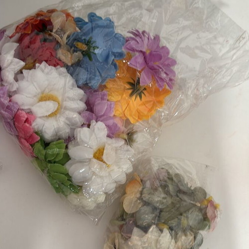 Craft supplies like new, boxes, stickers, decorative flowers and shells