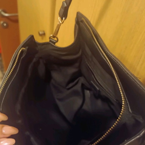 Handbag used with crossbody strap and spacious interior