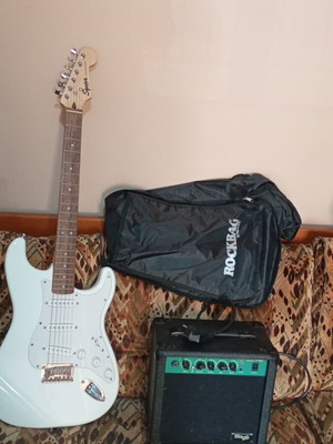 Electric guitar new with amplifier and case