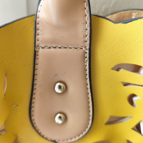 Yellow handbag used with beige details