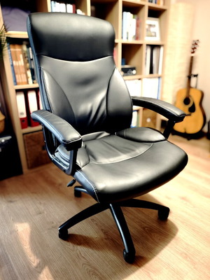 Office chair used, black matte color with minor wear on leatherette