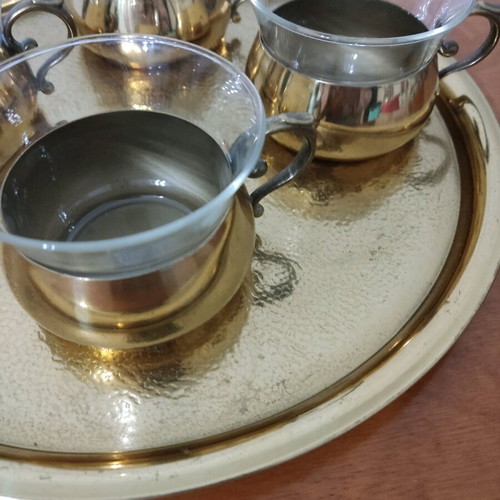 Bronze tea cups with glass on tray used