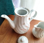 Porcelain teapot and creamer set like new with embossed designs