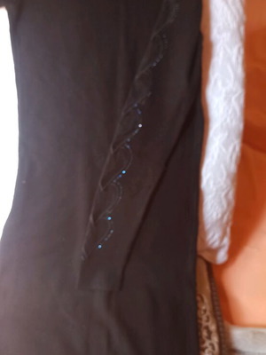Black knitted short dress with hearts on sleeves used