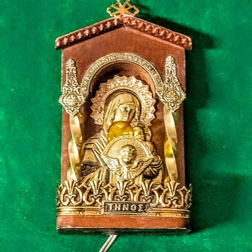 Vintage illuminated icon of Virgin Mary and Christ Child with lamp