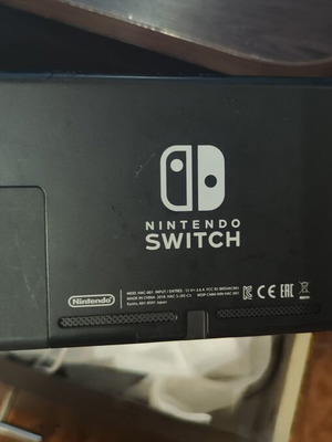 Nintendo Switch console with accessories, original controllers