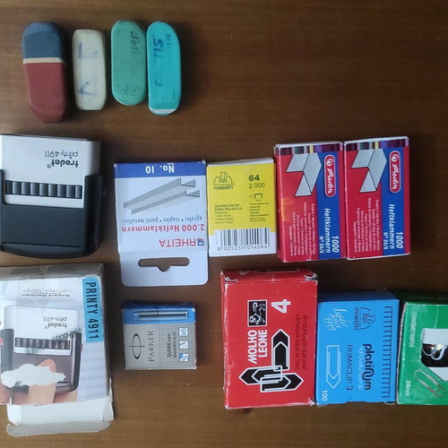 Set with stamp, erasers and used paper clips