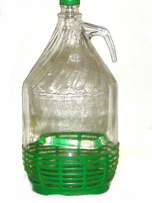 Νταμιτζάνα γυάλινη 5 lt μεταχειρισμένη με πρακτική λαβή