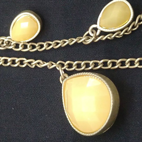 Double long necklace with matte gold chain and beige decorations