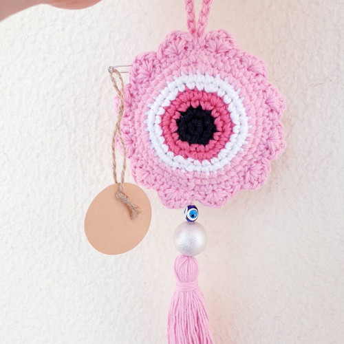 Handmade crochet evil eye in baby pink