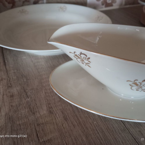 Gravy boat and deep plate used with floral patterns