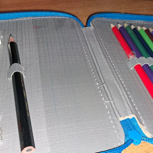 Children's pencil case used with colored pencils in good condition