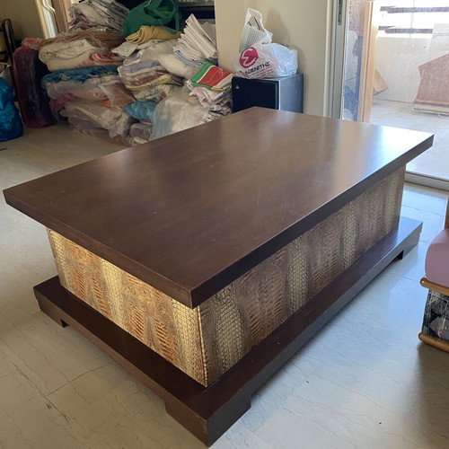 Coffee table like new with dark wood and crocodile leather texture