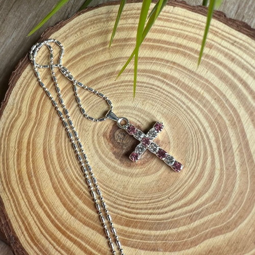 Cross like new with white and pink details