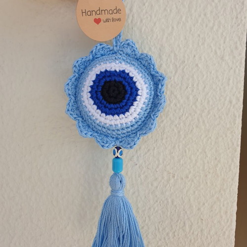 Handmade baby blue crocheted eye decoration