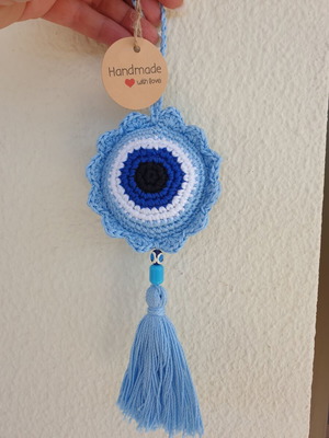Handmade baby blue crocheted eye decoration