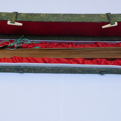 Traditional Chinese sandalwood fan with decorative tassel