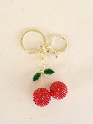 Cherry bag charm keychain like new, gold with red rhinestones