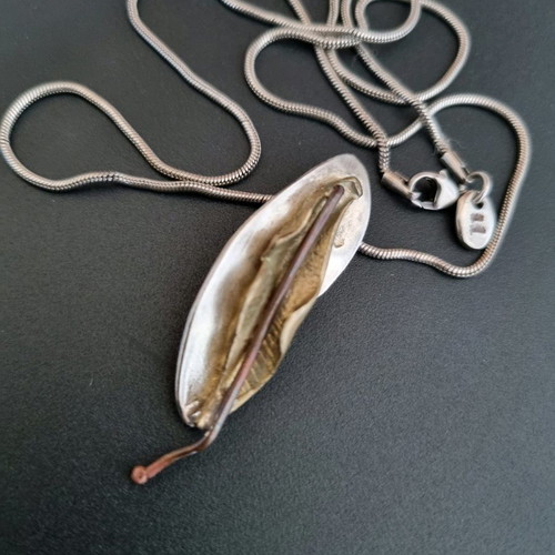 Silver handmade jewelry used with mixed materials leaf design