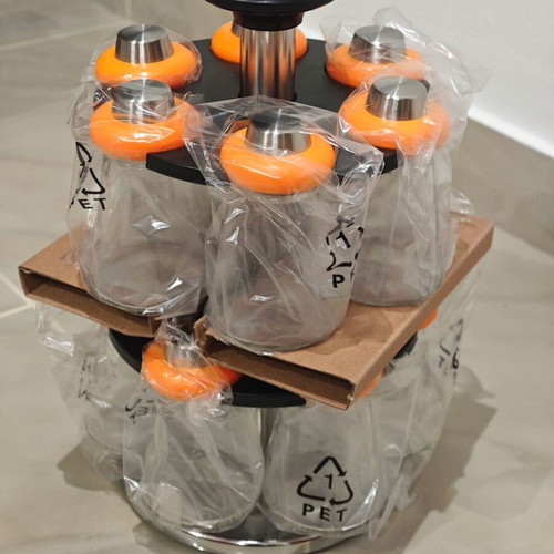 Rotating spice rack with 12 glass containers