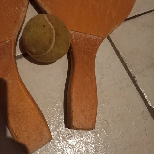Wooden beach rackets used, pair with ball