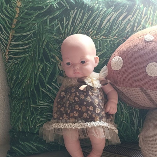 Doll with vintage dress