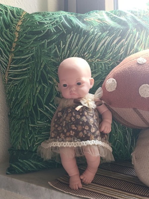 Doll with vintage dress