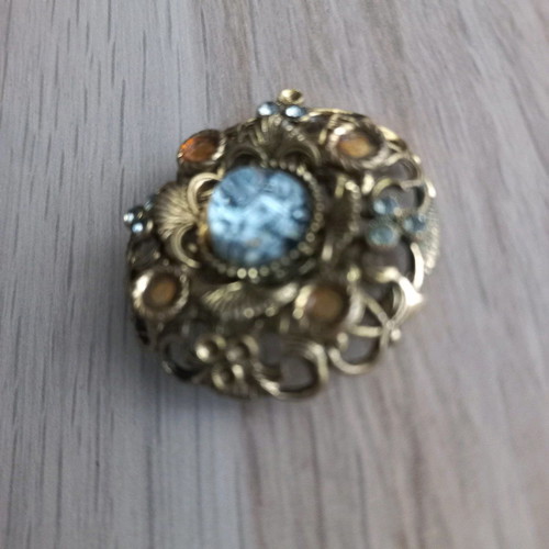 Traditional old brooch with stone