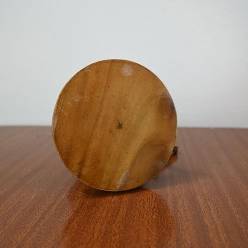 Vintage wooden carving of a man on a buffalo used