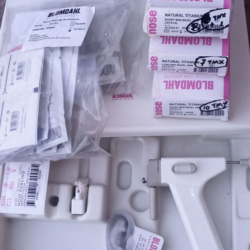 Nose Piercing Gun system like new with 27 nose earrings and tester