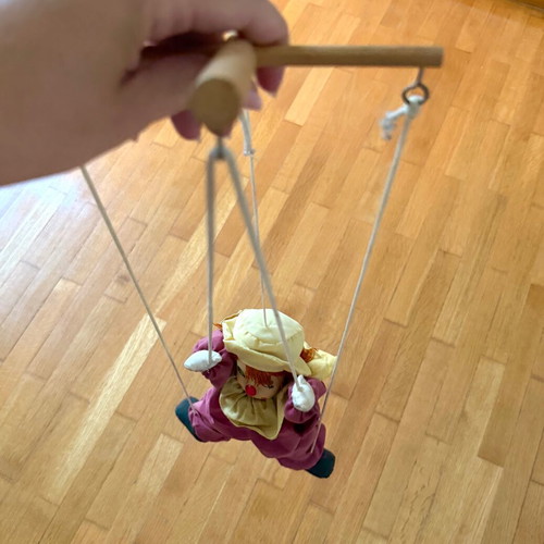 Vintage clown marionette with porcelain head and wooden control cross, like new