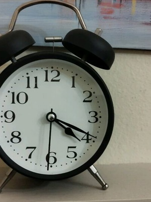 Analog tabletop clock used alarm