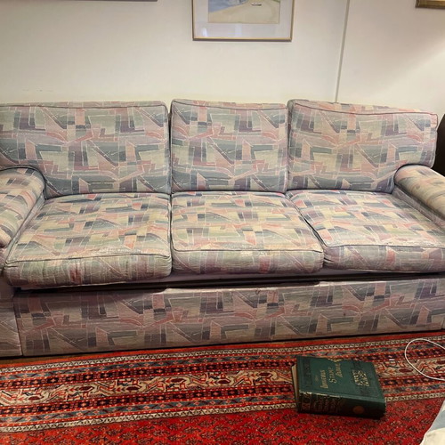 Three-seater sofa bed with extra cover and cushions