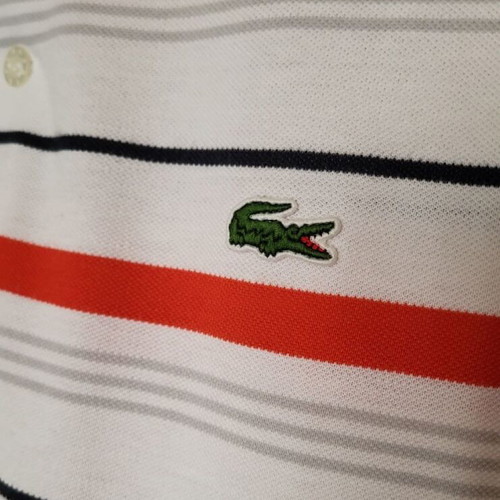 Lacoste polo used, size L, striped white and orange