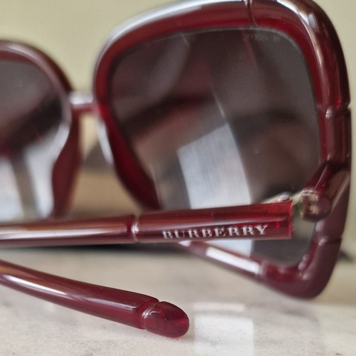 Burberry women's sunglasses used, burgundy with case
