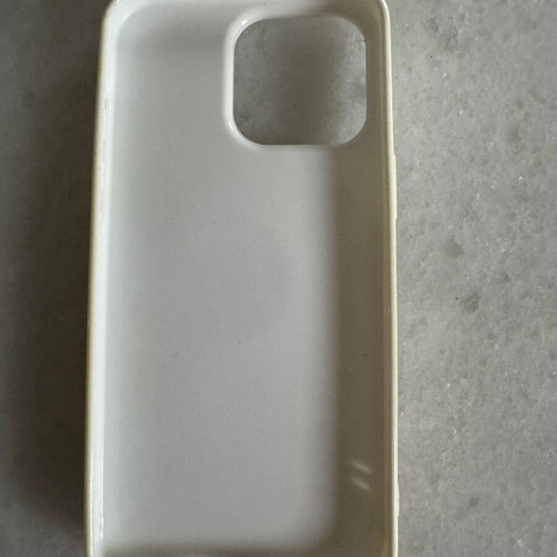iPhone 15 Pro Max white case used with finger grip holder