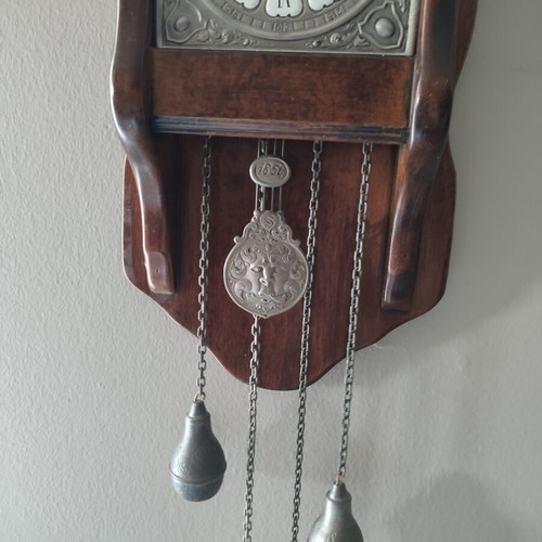 Wall clock made of solid walnut wood and pewter details like new